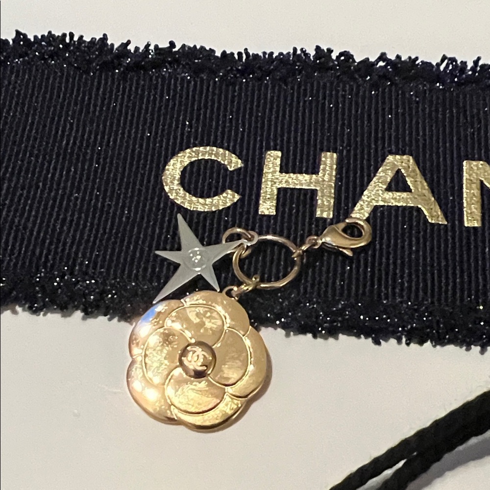 CHANEL Gold Floral Charm with Silver Star